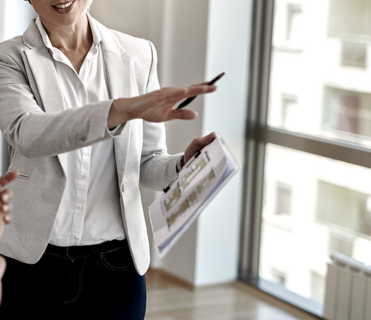 smiling-real-estate-agent-talking-with-couple-interested-buying-new-home_edited.png
