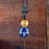 Thumbnail: 51.5" Tall Ceramic Sailor Ball with Finial Iron Garden Stake - Yellowith Blue