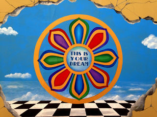 Alleyway mural in downtown Daytona Beach Florida Wheel mandala colorful mural painting art street checkerboard this is your dream sky clouds matrix