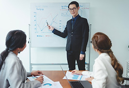 asian-businessman-presenting-his-work-corporate-colleagues-meeting-office.jpg