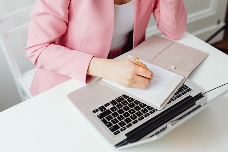 photo of a person using laptop for graphic design and marketing
