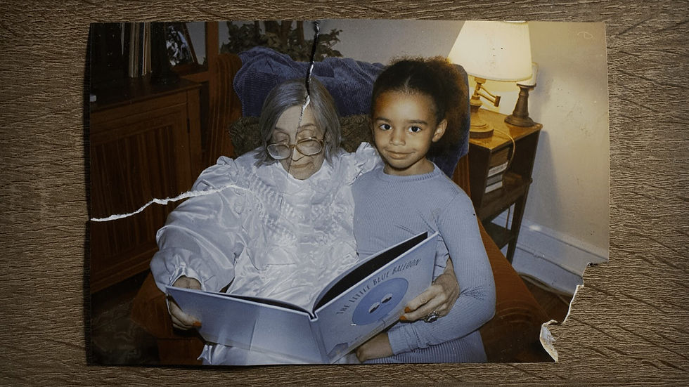 Elderly woman reading "The Little Blue Balloon" with a young girl. They're seated indoors by a lamp, reflecting warmth and comfort.