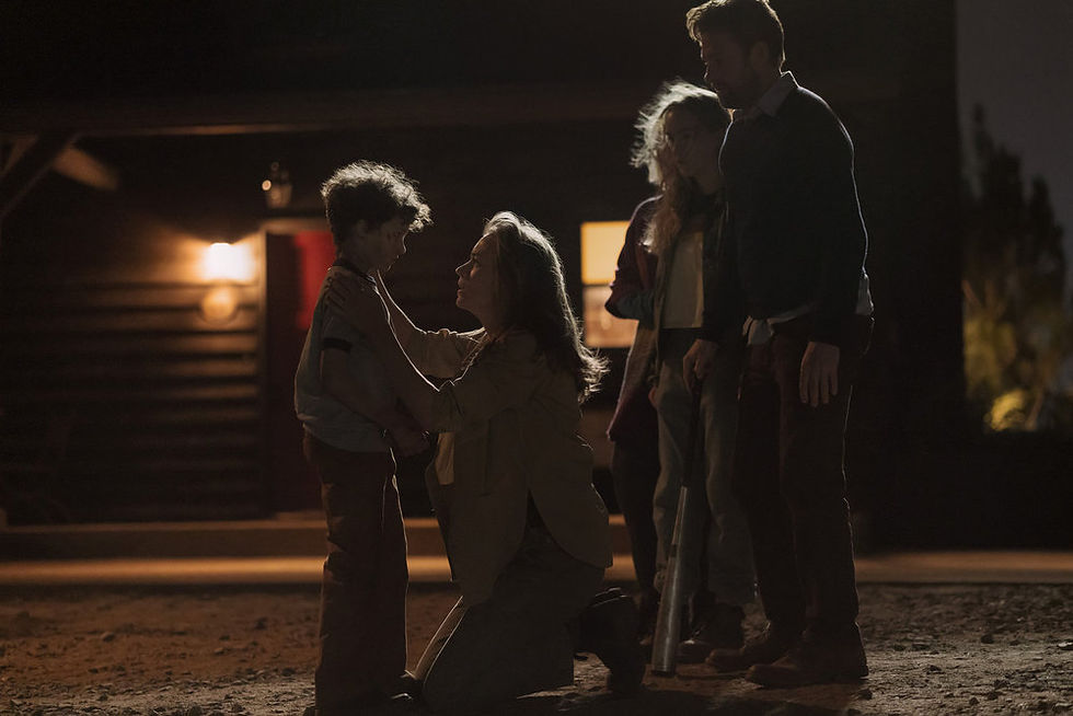 A family stands around each other having a serious conversation