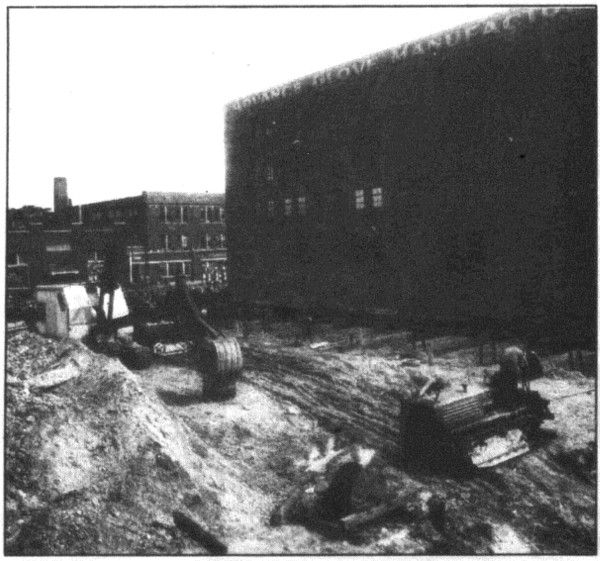 The building on Lafayette was moved on logs to make way for the Lodge Freeway.