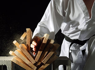 Blackbelt Breaking a Stack of Boards