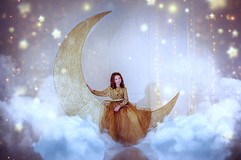 Beautiful%20little%20girl%20in%20gold%20dress%2C%20sits%20on%20the%20moon%20in%20clouds%20