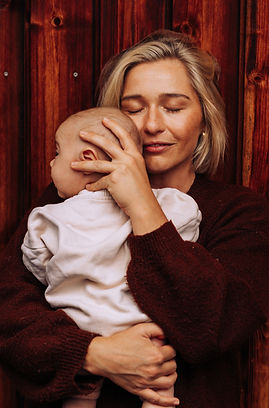 Motherhood photo of woman holding her young baby in arms, taken by Stills by JP, Sutherland Shire photographer