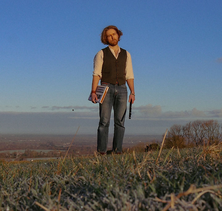 CAOIMHÍN (pronounced "kwee-veen") is a producer, singer, and multi-instrumentalist forging a soulful new Gaelic sound at the crossroads of folk and modern dance music.
Performing live yielding flutes, whistles, guitars, midi controllers and a bouzouki, he effortlessly combines traditional Irish elements, live looping, sampling and electronica into a unique danceable package that has graced stages all over Ireland and recently abroad (Australia, Italy, UK).
2025 saw the release of the trad fusion musician’s debut album ‘Ríocht Na Sí’ which was nominated for contemporary album of the year at the NÓS music awards in February, further adding to the building momentum being generated by the boundary pushing artist.
It was also a big year for the Irish musician in other ways with him being offered a residency in the famed Guinness Storehouse in Dublin for the summer months.
CAOIMHÍN has also recently caught the attention of TV producers with two TV series that the musician will feature on (‘Cara Sa Cheol’ and ‘Casadh Sa Cheol’) due to air in early 2026.