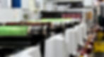 flexographic press with operator in the background