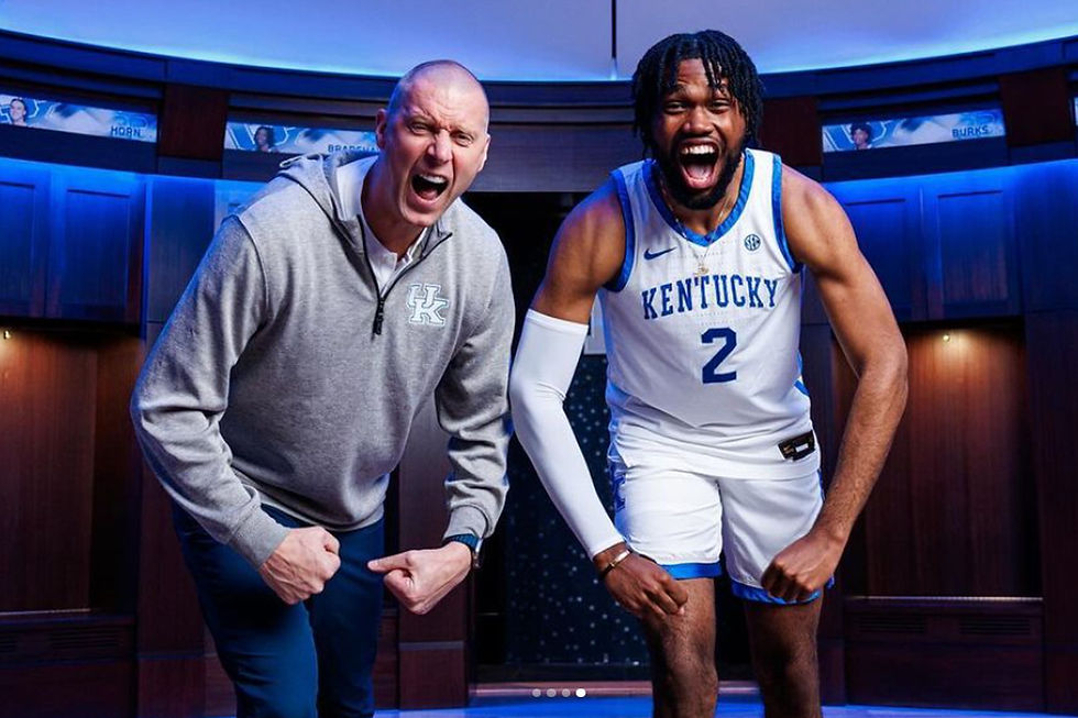 Kentucky Wildcat transfer Ansley Almonor flexing with Kentucky Wildcats Basketball Head Coach Mark Pope