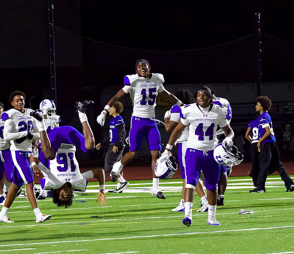 Middletown players celebrating after the 22-21 comeback win against Cornwall.
