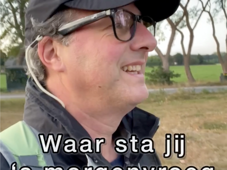 Man walking in nature wearing smart glasses and talking about innovation