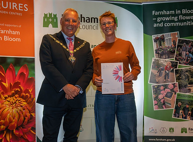 Erica receiving her certificate from the Mayor. Image credit Farnham Town Council.jpg
