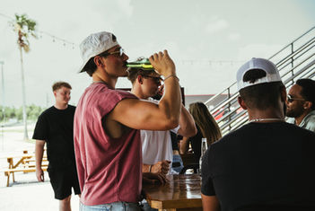Friends drinking beverages outdoors.