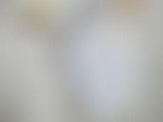 Notebook with handwritten priorities and meal reminders, alongside a black pen, on a textured surface. Bright colors and stickers add charm.