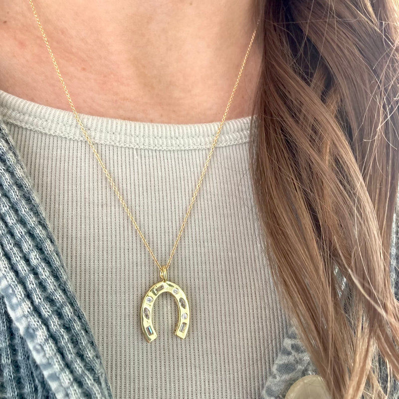 Horseshoe necklace is a symbol of good luck