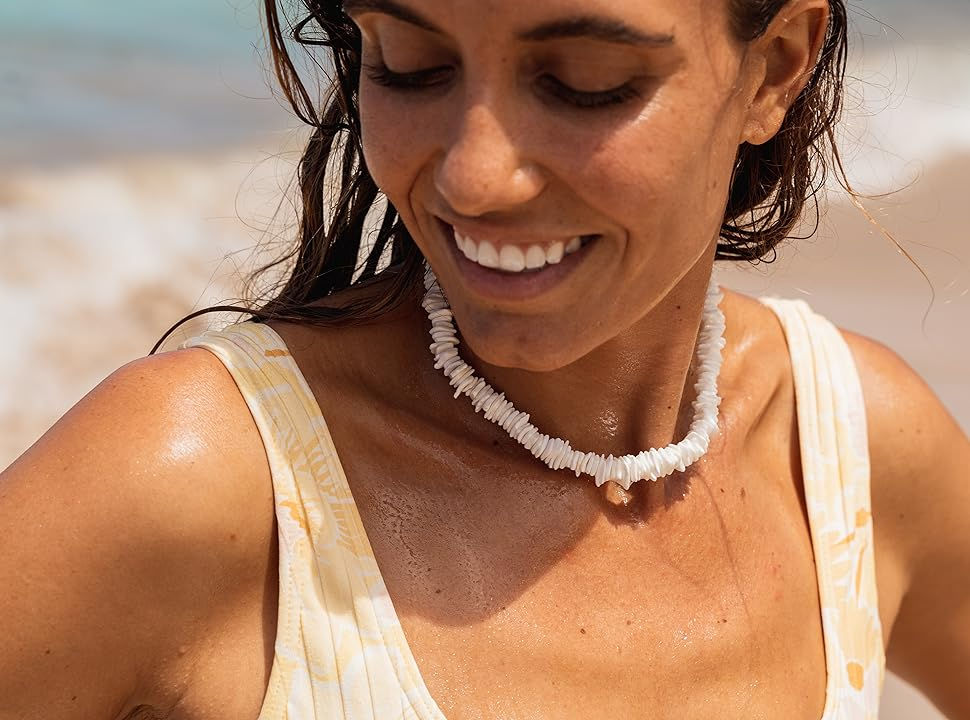 Woman wearing puka shell necklace