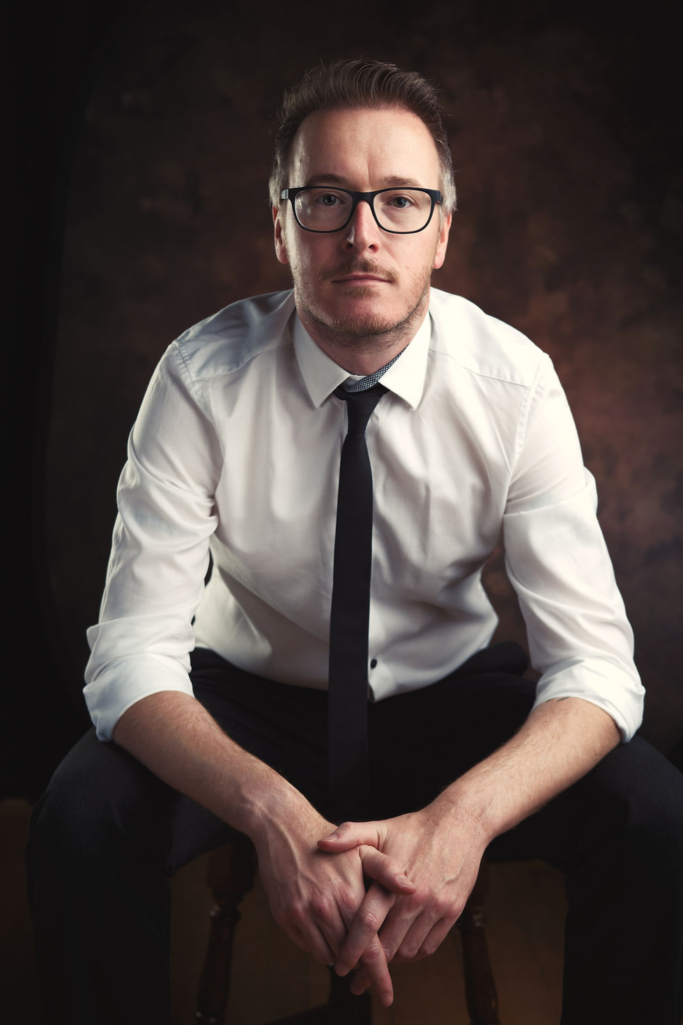 Adrian Young, the owner of Day Tripper Driving Tuition, sat down on a chair.