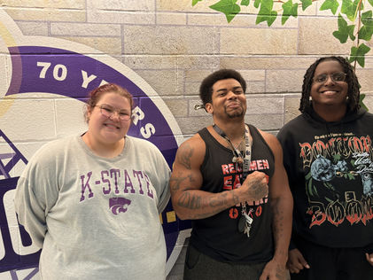 Hosts of "The Evening Drive" Annalise Angell and Derek Foster pose for a photo with Bryan "Nappy" Vereen, a local music artist, bodybuilder and more.