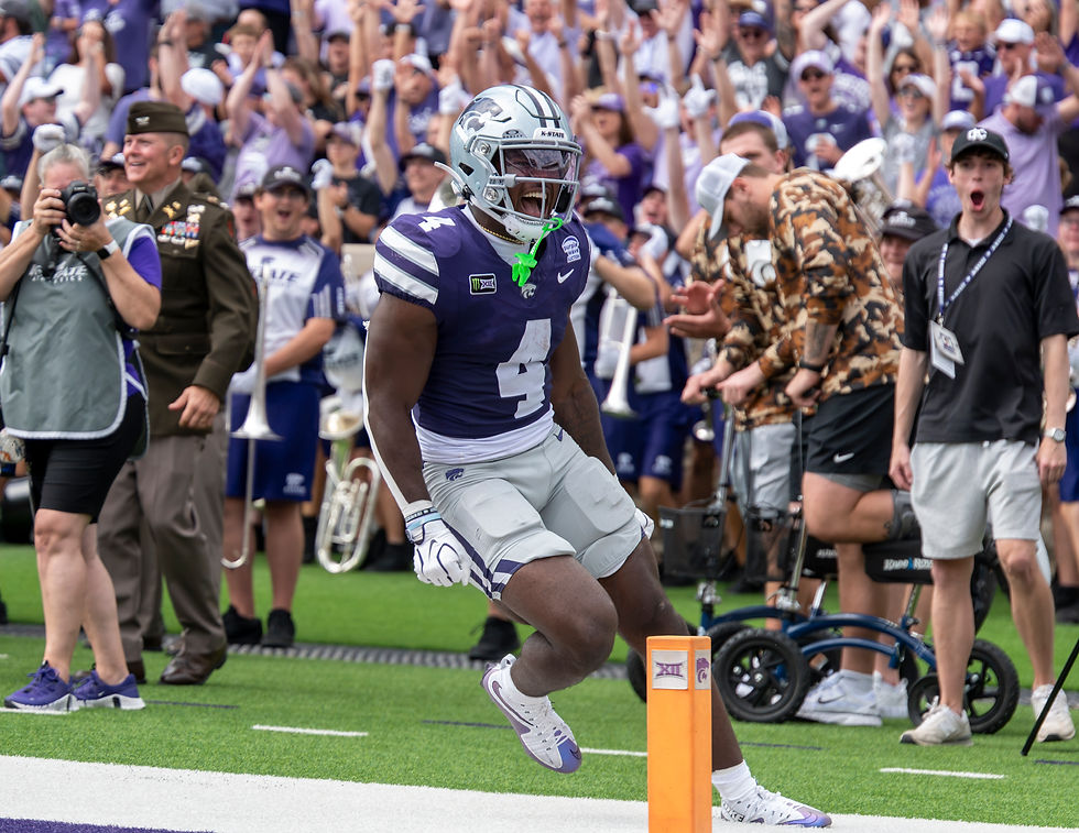 K-State running back Joe Jackson screams in excitement after scoring a receiving touchdown against Washington State. Jackson had four catches for 48 yards in the Wildcats' 34-7 win. (Ashton Todd)