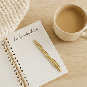 Daily rhythm notebook with a cup of coffee