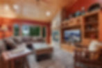 Great Room with Stone Fireplace and Lake Views
