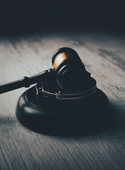 a judge's gaven on a wooden table_edited