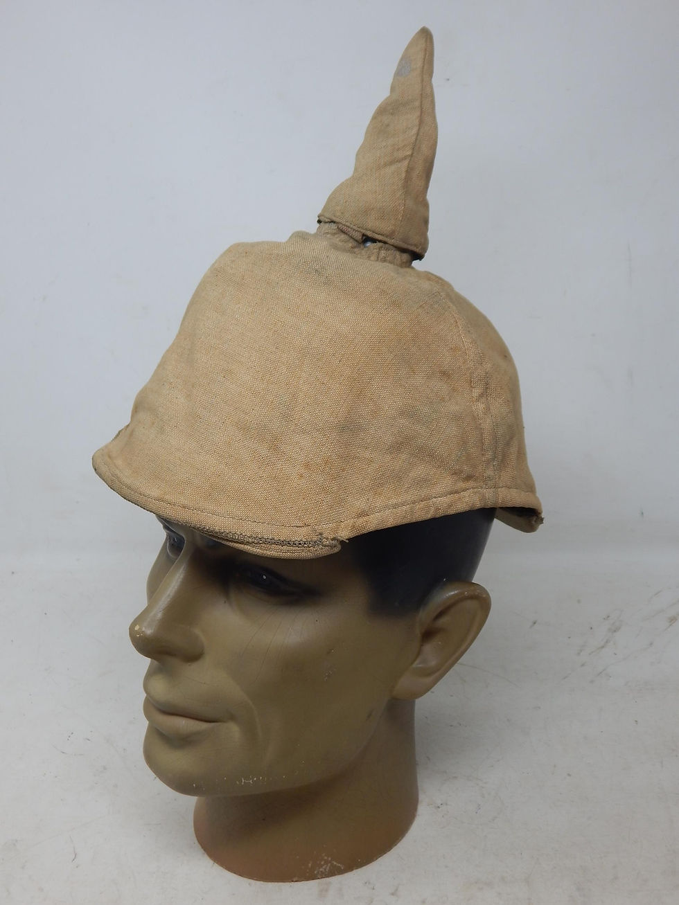 A WWI Imperial German Army pickelhaube uniform helmet with cover.