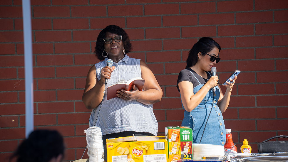 Woman speaking and encouraging attendees at a ministry eventA7403368