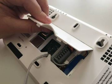 Place the top of the cover onto the panel’s back plate.