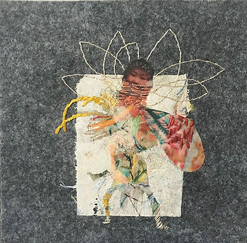 Hand embroidered fairy child bundled up in a scarf with seven light wings