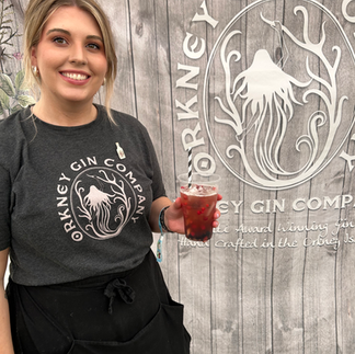 Becca, Orkney Gin Company, holding a cocktail