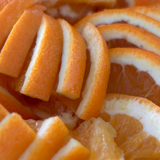 Chopped oranges ready to add to cocktails at an event