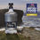 Thumbnail: Orkney Vodka bottle by Orkney Gin Company on a cliffs edge with the sea and another cliff in the distance