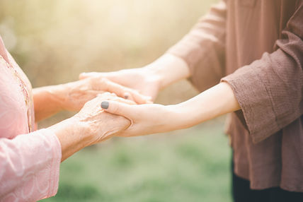 vecteezy_old-and-young-woman-holding-hands_1343751.jpg