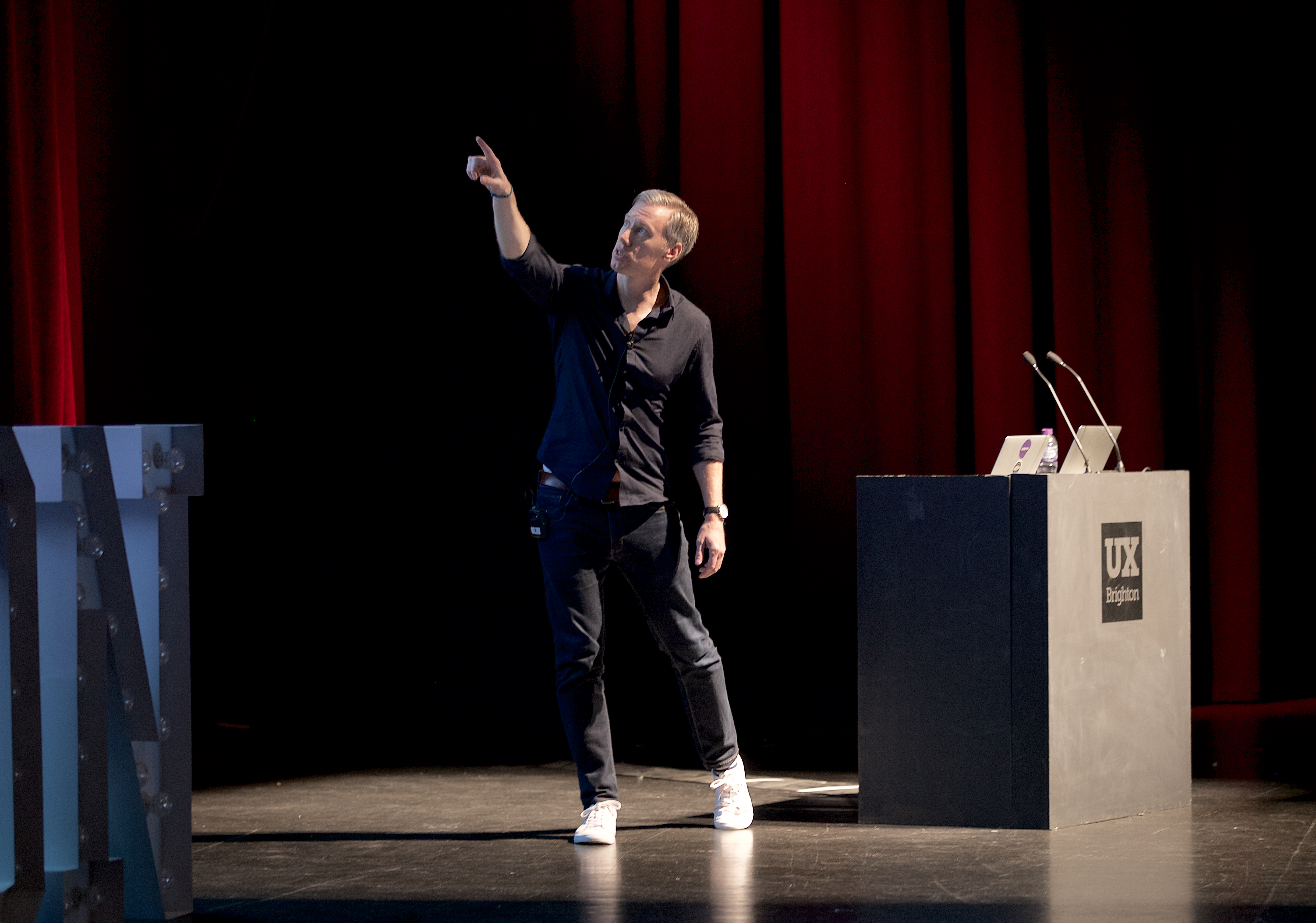 Martyn speaking on stage at a design conference