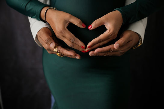 Close up of Woman and Man Hands on Pregnant Abdomen More info Share