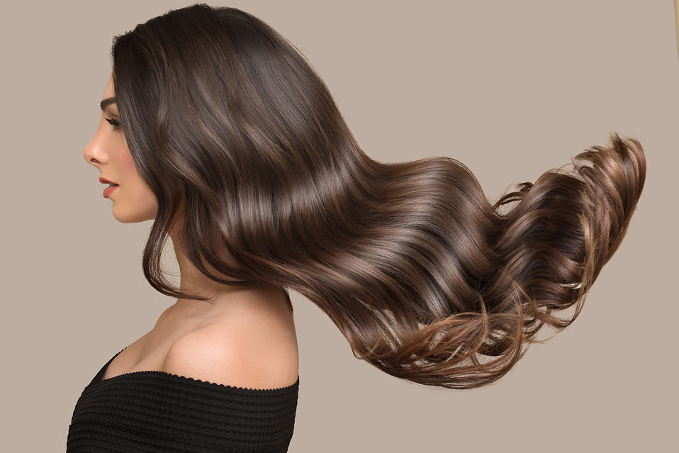 woman shiny long wavy hair up. side view. grey background.jpg