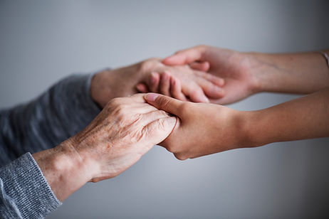 Young hands holding older hands.jpg
