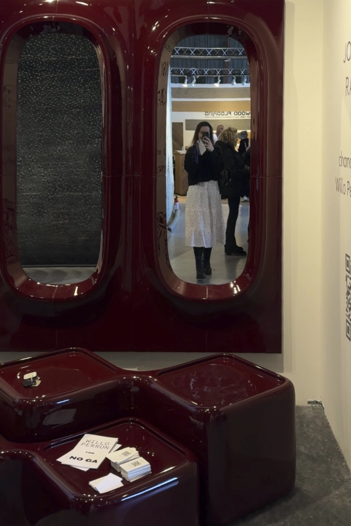 High-gloss burgundy installation exploring reflection, color depth, and sculptural geometry.