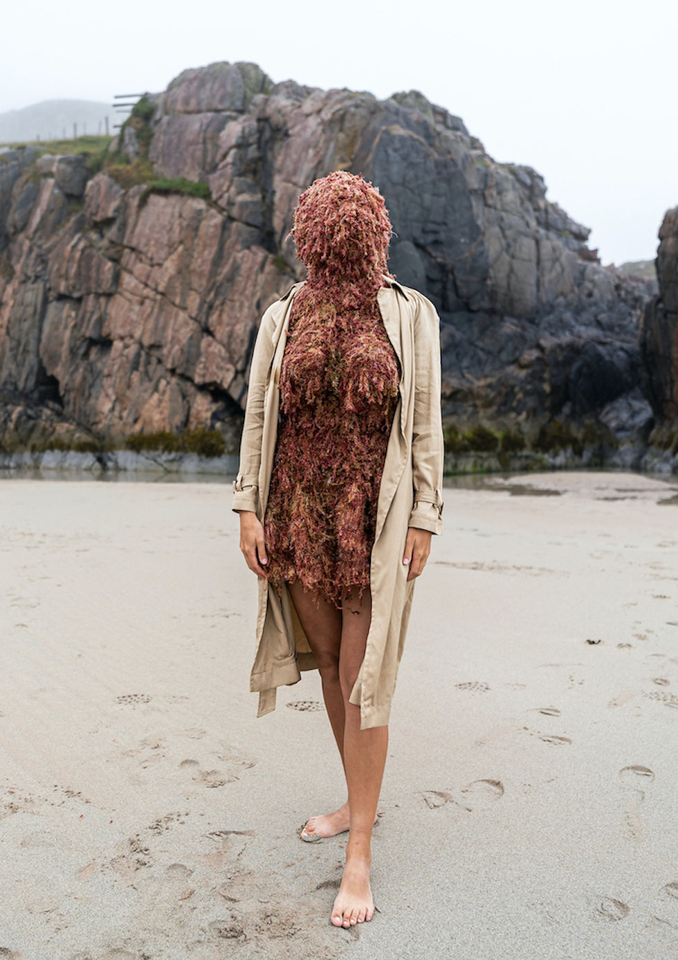artwork svetlana ochkovskaya women on the sand her face is cover by algae