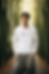 sweatshirt-mockup-of-a-serious-ai-created-man-posing-against-some-trees-m37733.png
