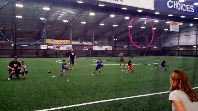 Young baseball players practicing on turf