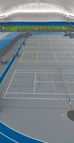 SPECTO® effectively contains basketball games and players in the center of a running track