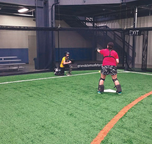 Spectators easily watch two athletes train through an indoor SPECTO® System's mesh