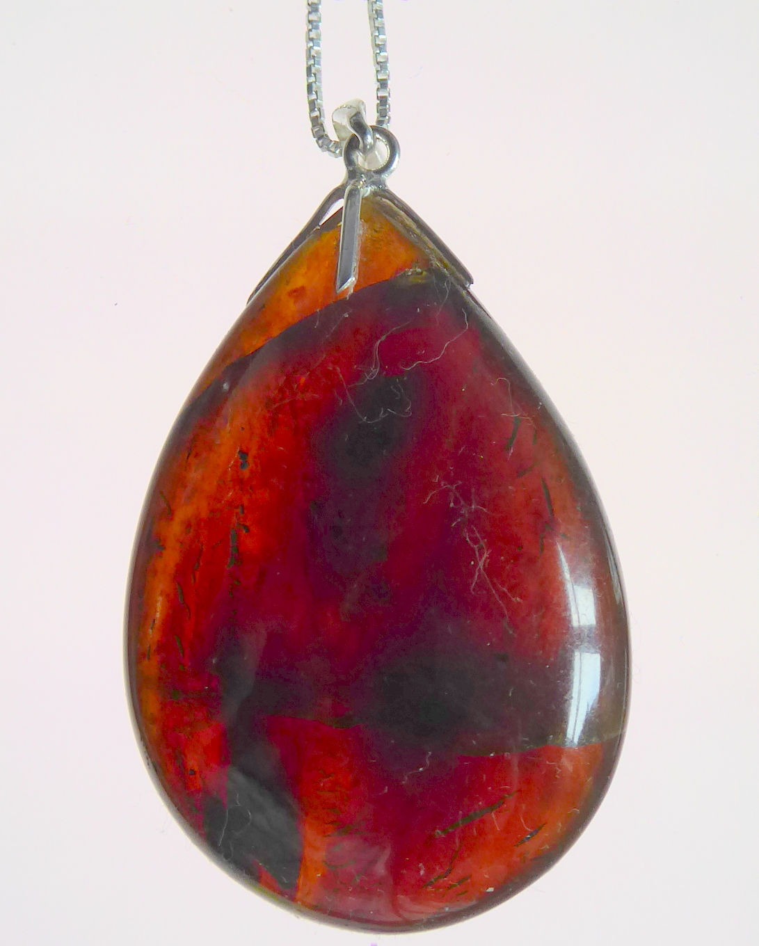 Blue Amber Polished Drop Pendant and Chain. 58mm long.