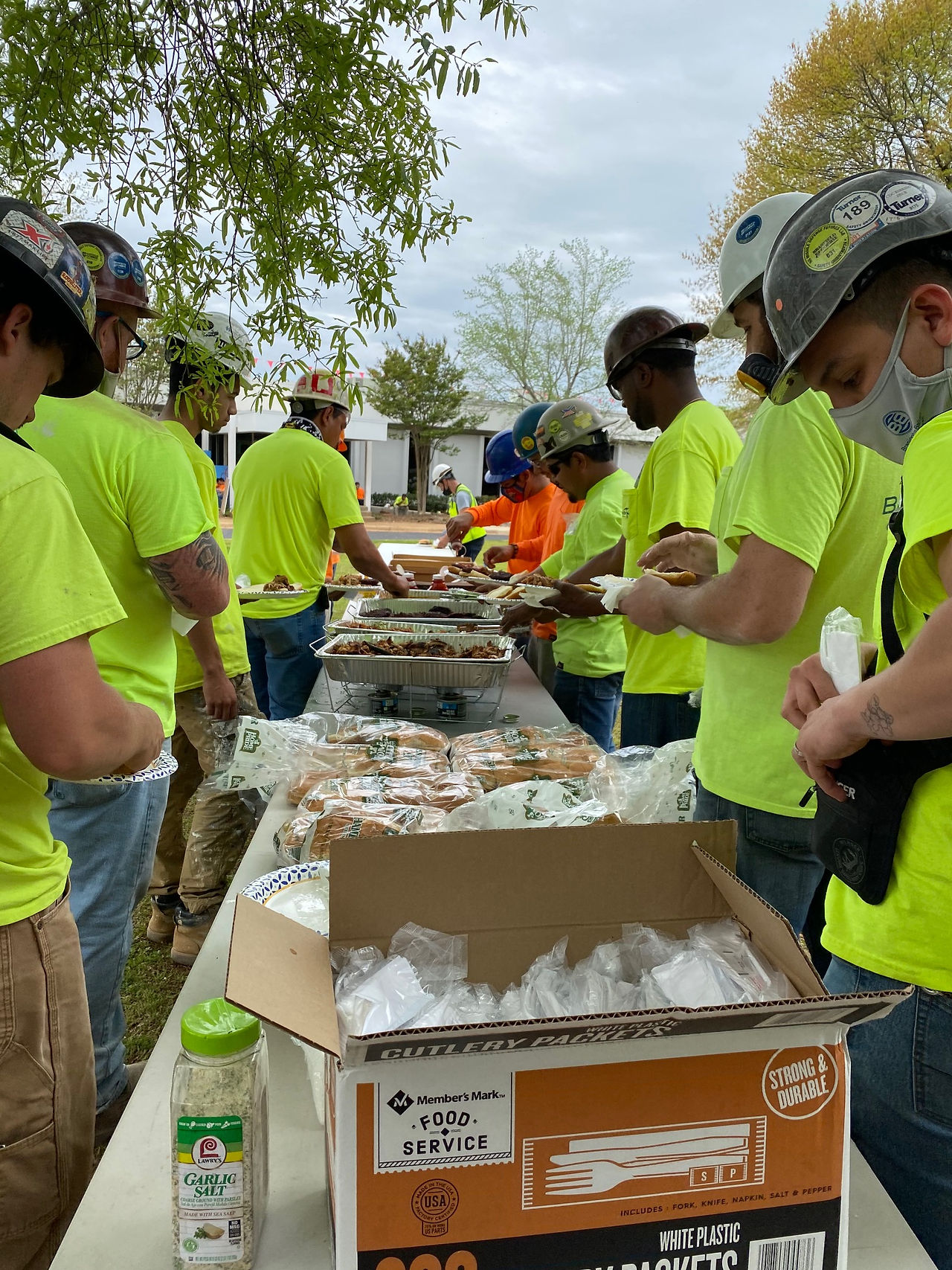 Marathon Electrical Contractor employees at Project NHA break for community lunch