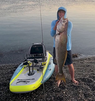 Logan Downing with a White Sea Bass on the Hobie iTrek 11 in Baja Mexico