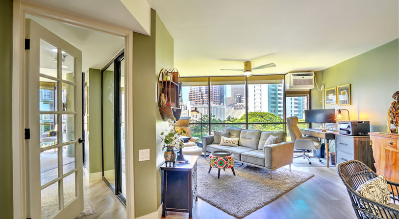 A glass door into the hallway creates architectural interest and allows light to permeate the space.