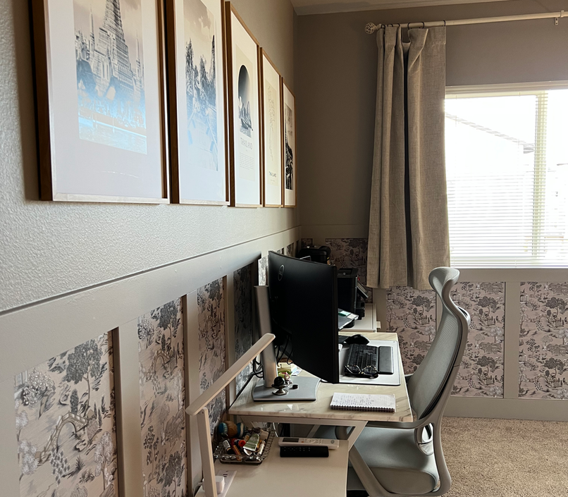 Art and wallpaper set the stage for a home office that highlights it's Asian heritage.  A soft backdrop to be productive!